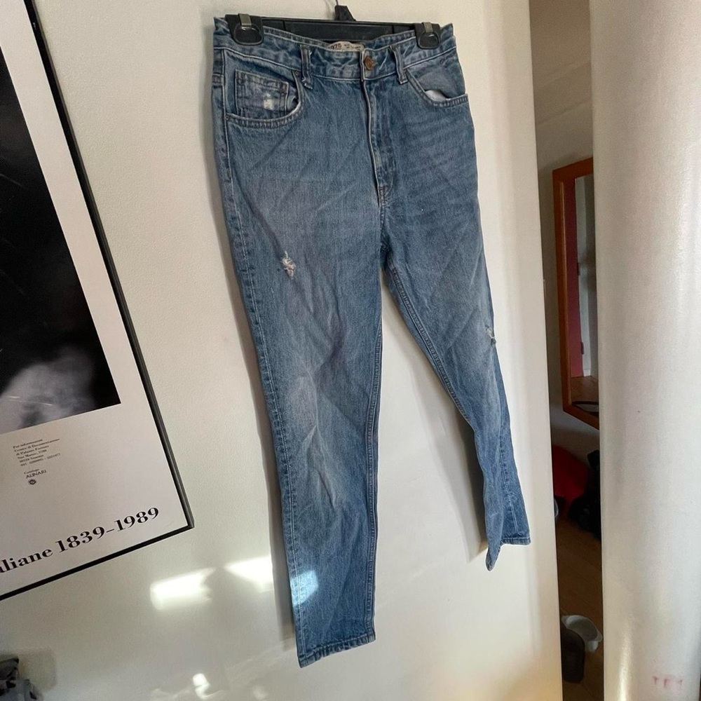 Zara distressed high waisted tapered leg blue jeans.